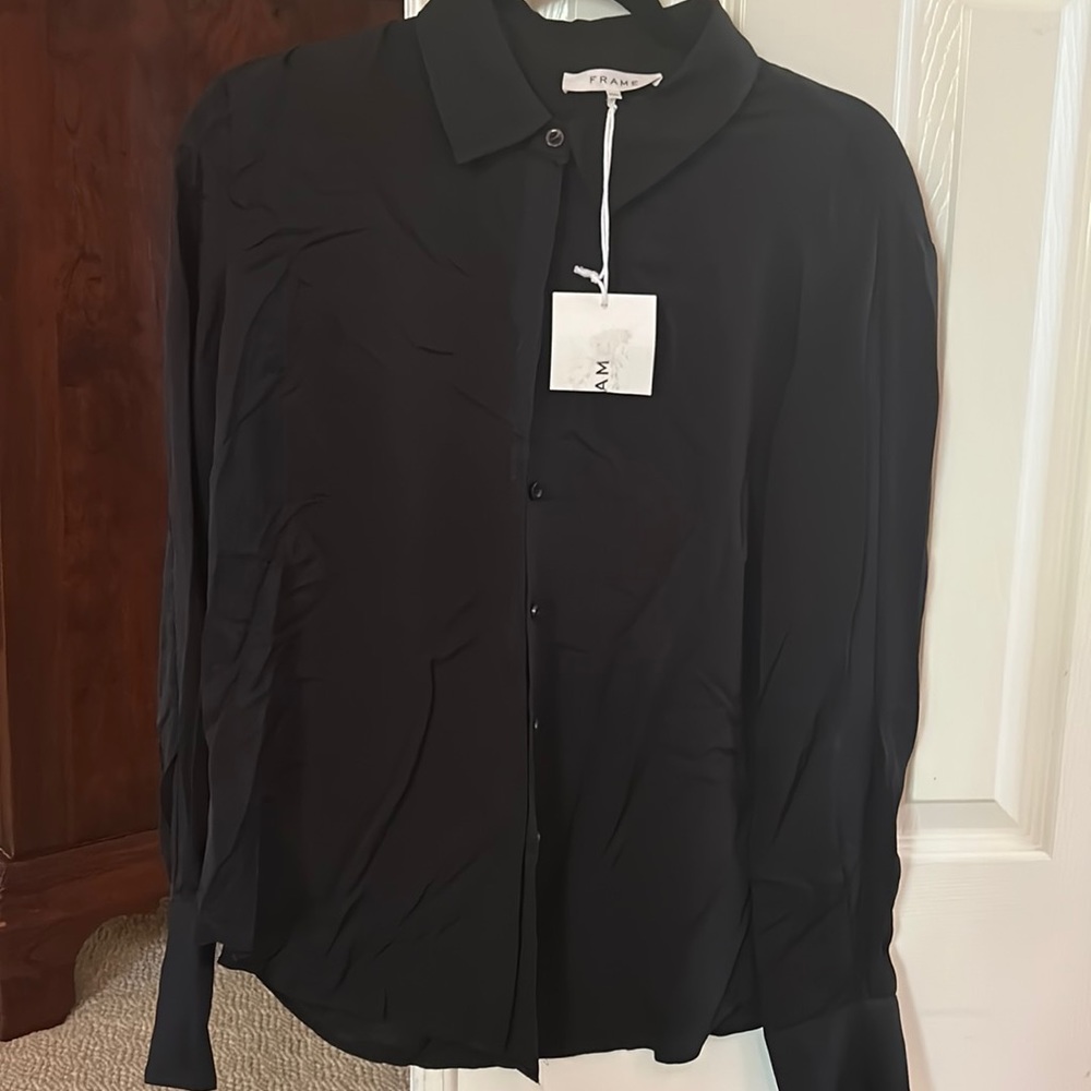 Pics show tags.  NO TAGS New.  No tags   FRAME black  100% silk blouse